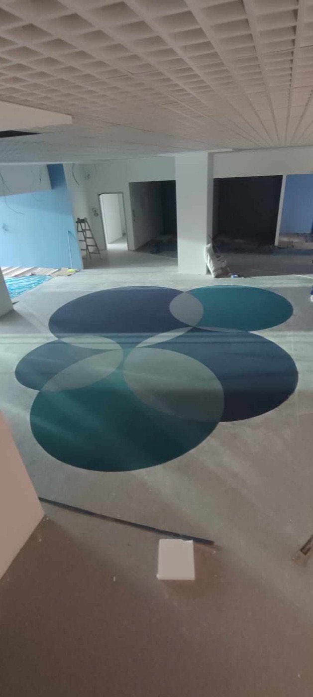 Turkuaz tonlarda daire desenli halı